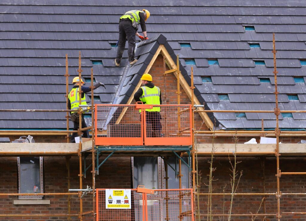 Builders make a roof